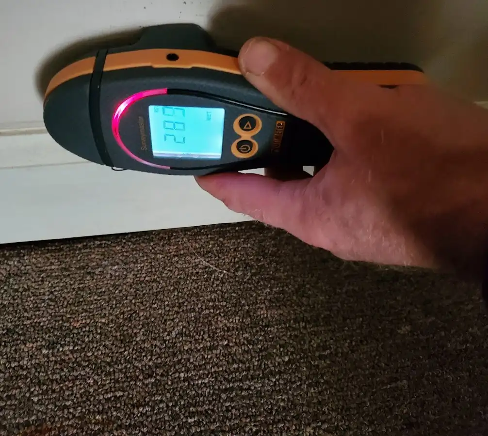Moisture detection at baseboard during Burst Pipe Cleanup in La Quinta
